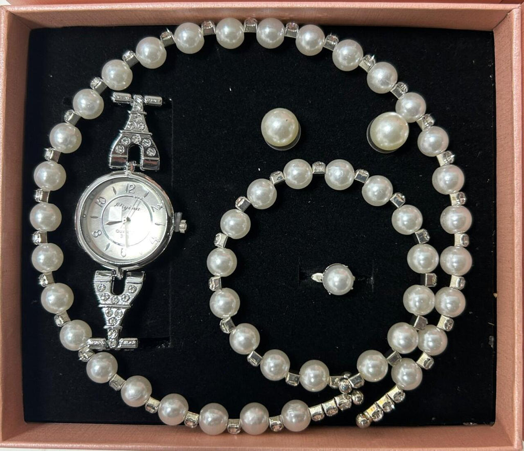 Conjunto de joyas plateado con perlas aleatorio.